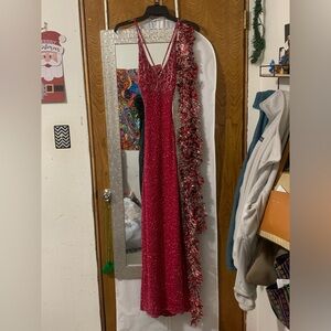 Red/pink, backless, beaded, prom style dress with a slit